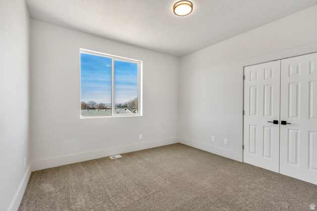 547 North Hvn Drive Mapleton, UT 84664 - Photo 15 of 23 Unfurnished bedroom with light carpet and a closet