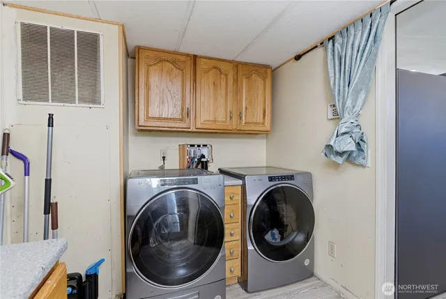 a view of a hallway with washer and dryer