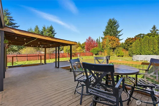 a view of a chairs and table in patio