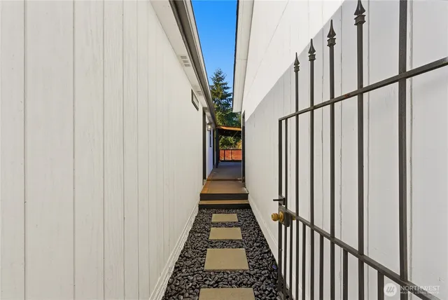 a view of an entryway with wooden floor