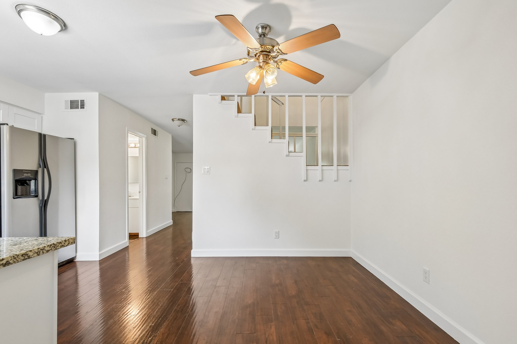4202 Hudson Bend Road, Unit B Austin, TX 78734 - Photo 6 of 26 a view of an empty room with window and wooden floor