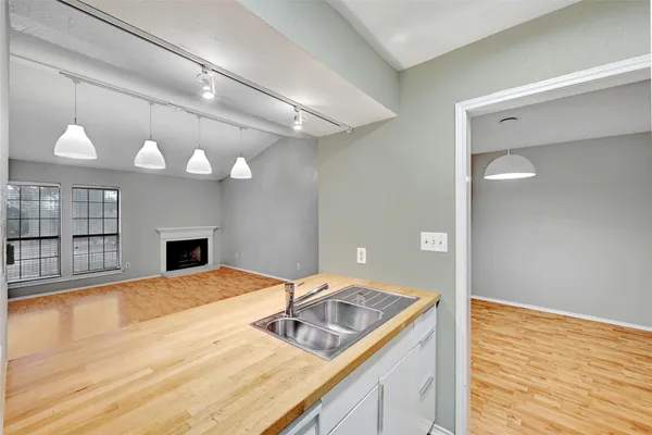 a view of a kitchen with a sink and a kitchen counter top