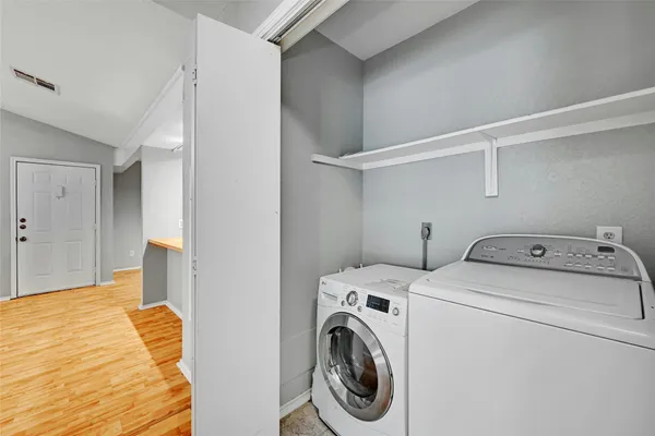 a utility room with dryer and washer