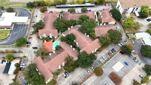 an aerial view of a house with outdoor space