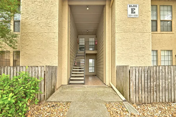 a view of a wooden door of the house