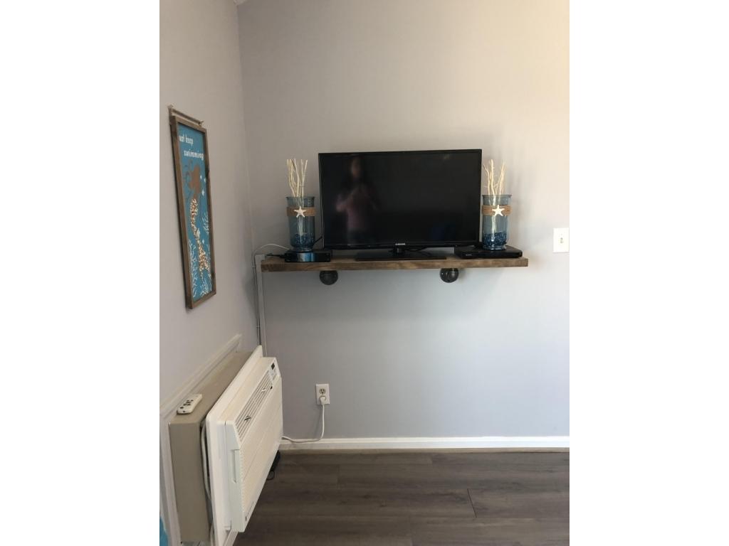 376 Mile Road, Unit 203 Wells, ME 04090 - Photo 18 of 26 18-Living Area-TV-AC Unit
