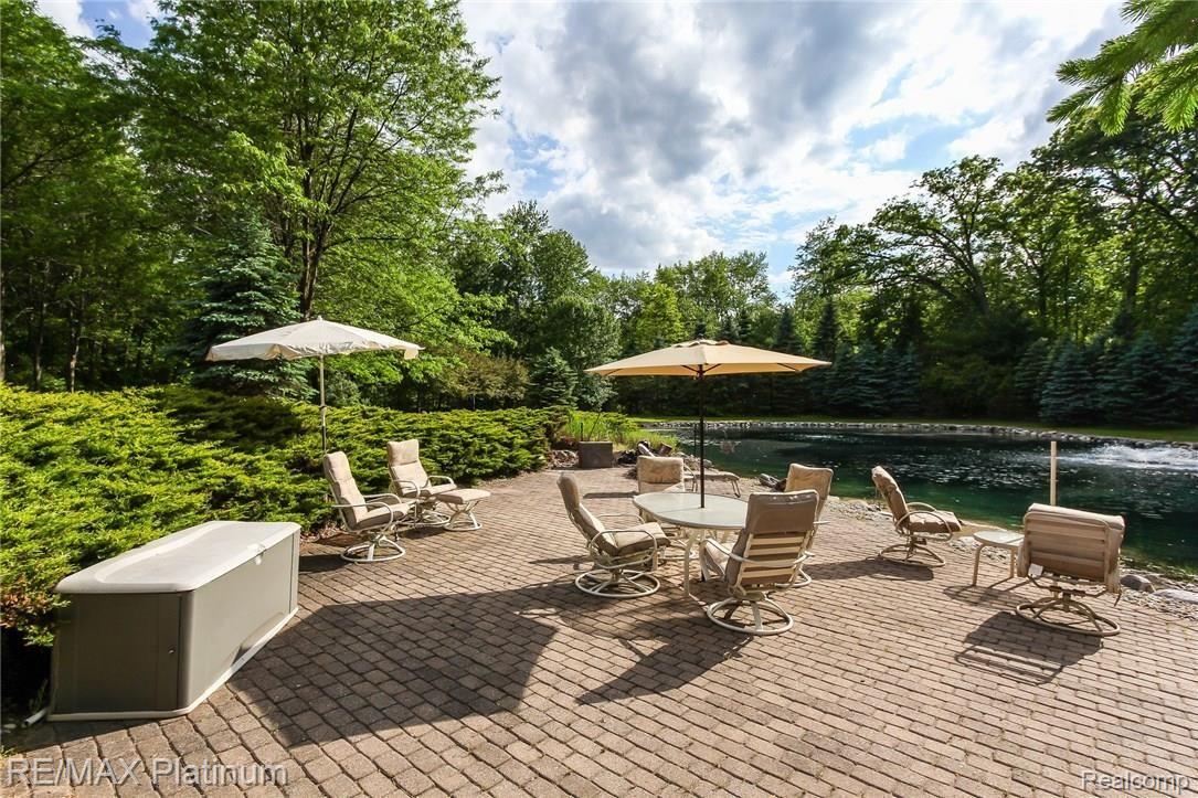2445 Shehan Road Pinckney, MI 48169 - Photo 28 of 41 Relaxing patio to enjoy the private pond