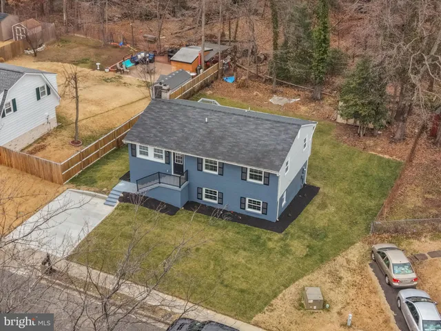 a aerial view of a house with a yard