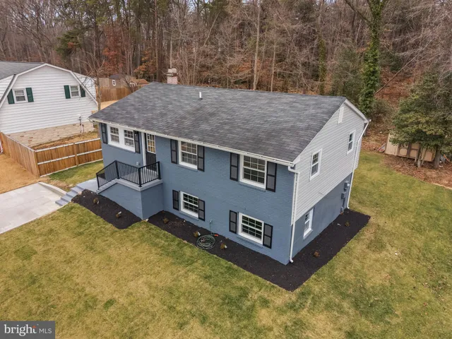 a aerial view of a house with a yard