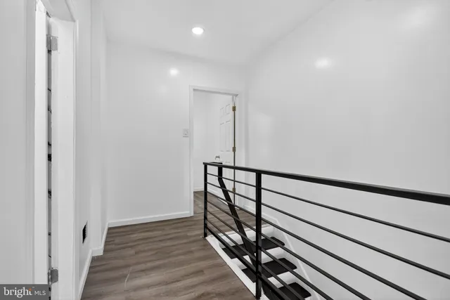 a view of entryway with wooden floor