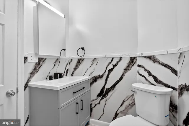 a close up of a sink and a toilet