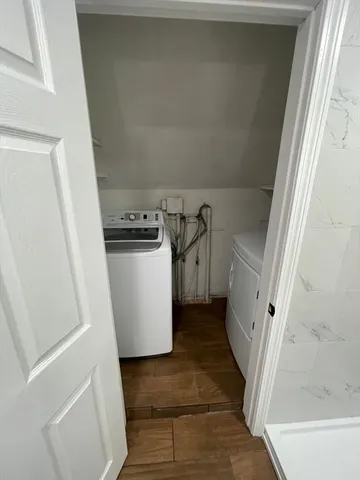 a view of a kitchen from a hallway