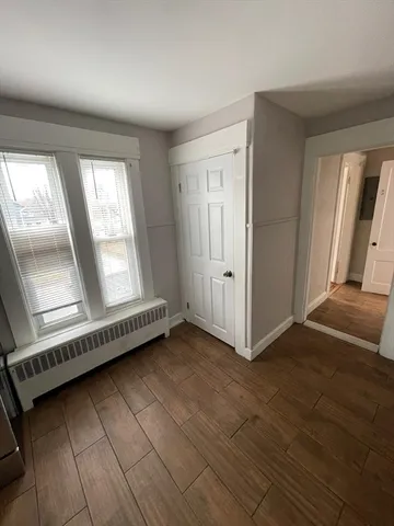 a view of an empty room with glass door