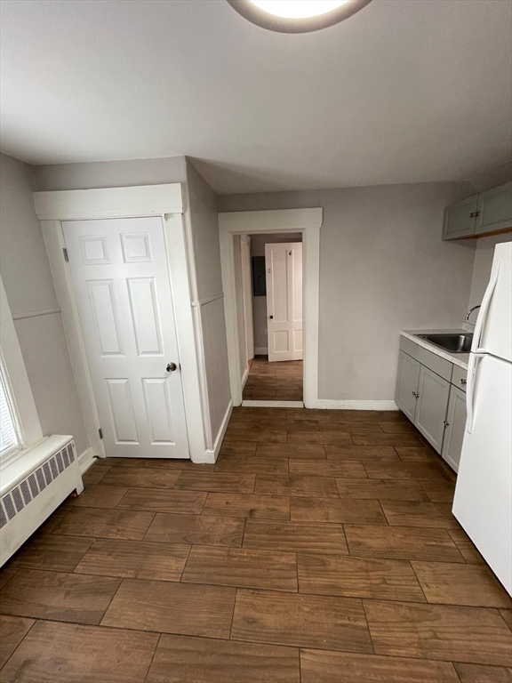 401 South Beech Street, Unit 2 Manchester, NH 03103 - Photo 7 of 7 a view of an empty room and wooden floor