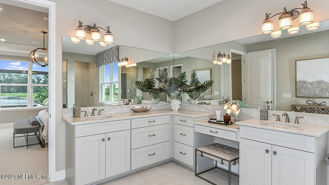 518 Marquesa Circle St. Johns, FL 32259 - Photo 13 of 27 a bathroom with a sink vanity and mirror