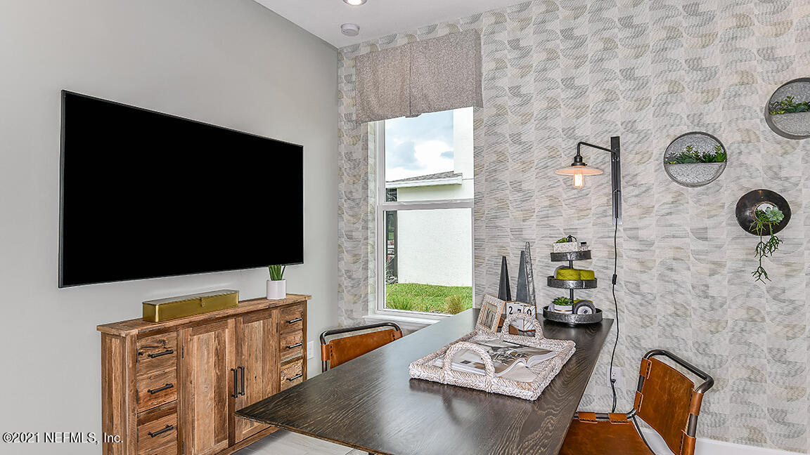 518 Marquesa Circle St. Johns, FL 32259 - Photo 16 of 27 a living room with furniture and a flat screen tv