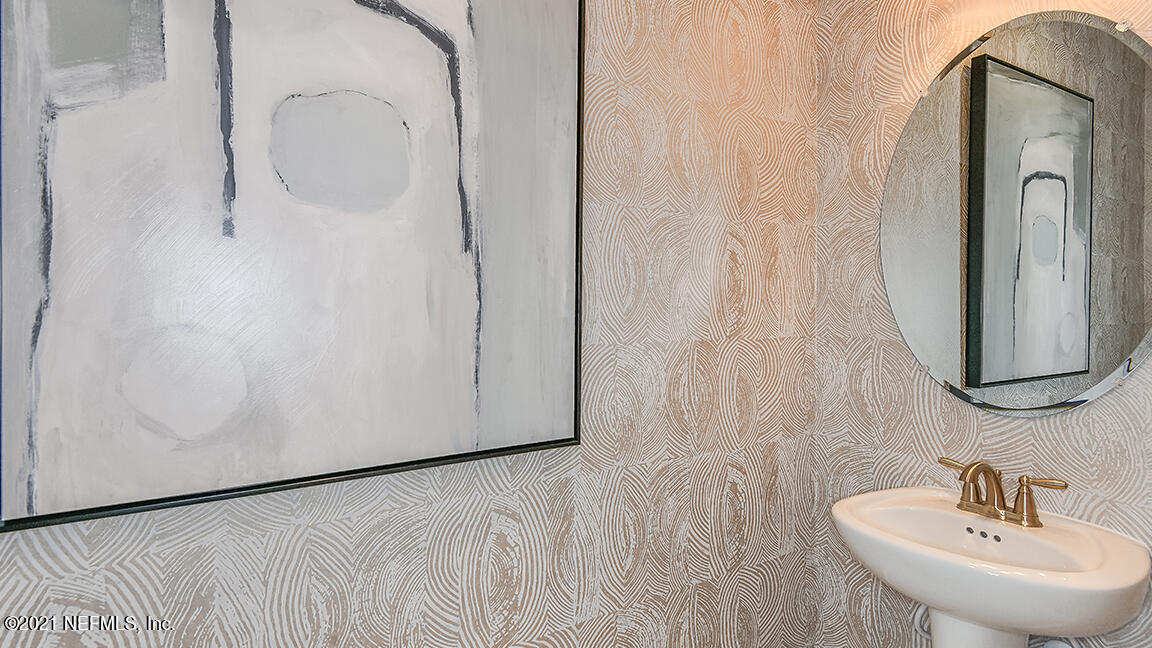 518 Marquesa Circle St. Johns, FL 32259 - Photo 18 of 27 a bathroom with a sink and a mirror