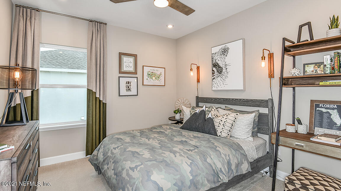 518 Marquesa Circle St. Johns, FL 32259 - Photo 21 of 27 a bedroom with a bed and a painting on the wall