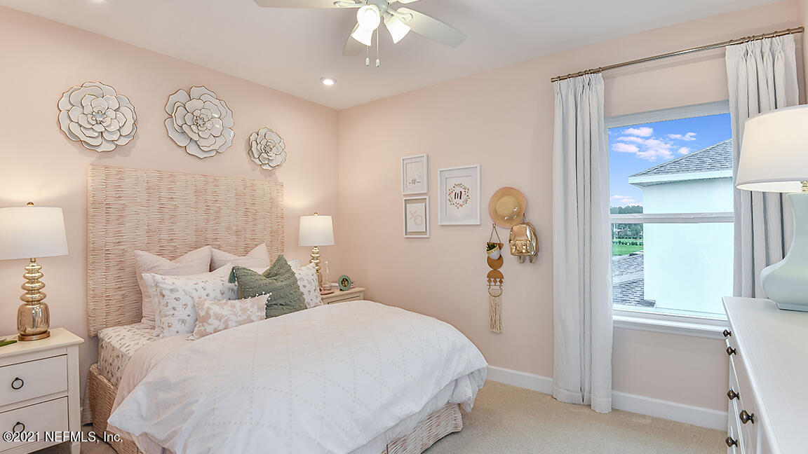 518 Marquesa Circle St. Johns, FL 32259 - Photo 24 of 27 a bedroom with a bed and a table