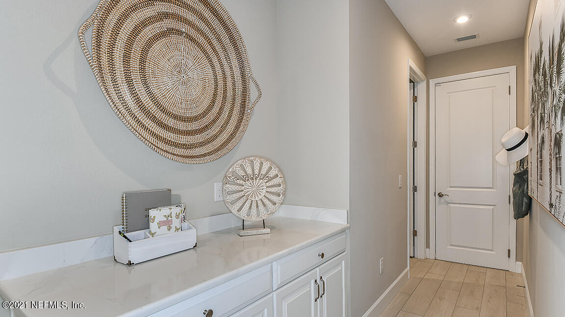 518 Marquesa Circle St. Johns, FL 32259 - Photo 26 of 27 a bathroom with a sink a mirror and a shower