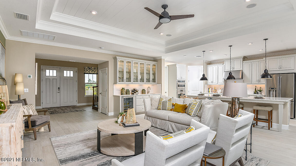 518 Marquesa Circle St. Johns, FL 32259 - Photo 4 of 27 a living room with furniture kitchen view and a wooden floor