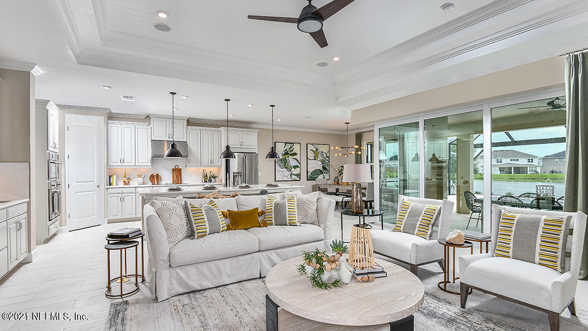 518 Marquesa Circle St. Johns, FL 32259 - Photo 7 of 27 a living room with stainless steel appliances kitchen island furniture and a large window
