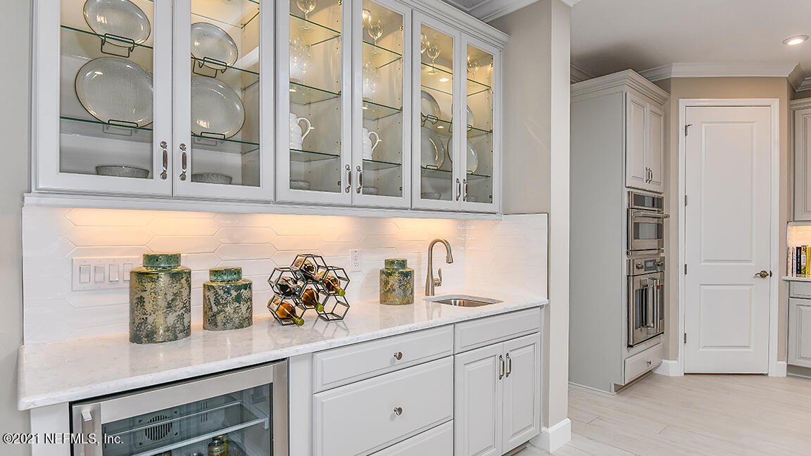 518 Marquesa Circle St. Johns, FL 32259 - Photo 8 of 27 a kitchen with stainless steel appliances granite countertop a refrigerator and a window