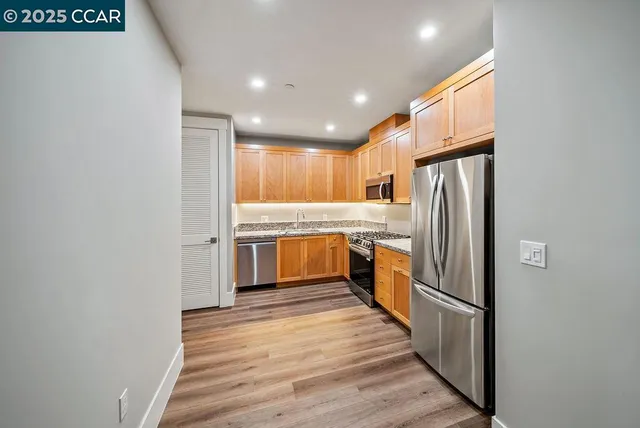 a view of room with wooden floor