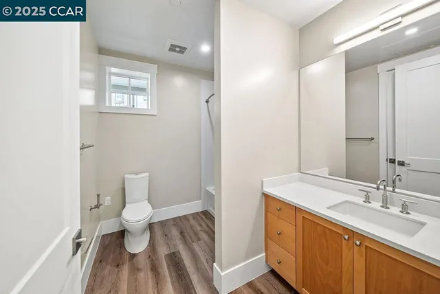 a bathroom with a toilet and a bathtub