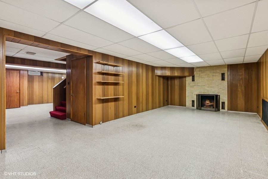 725 Milton Road Inverness, IL 60067 - Photo 20 of 24 a view of an empty room with a fireplace