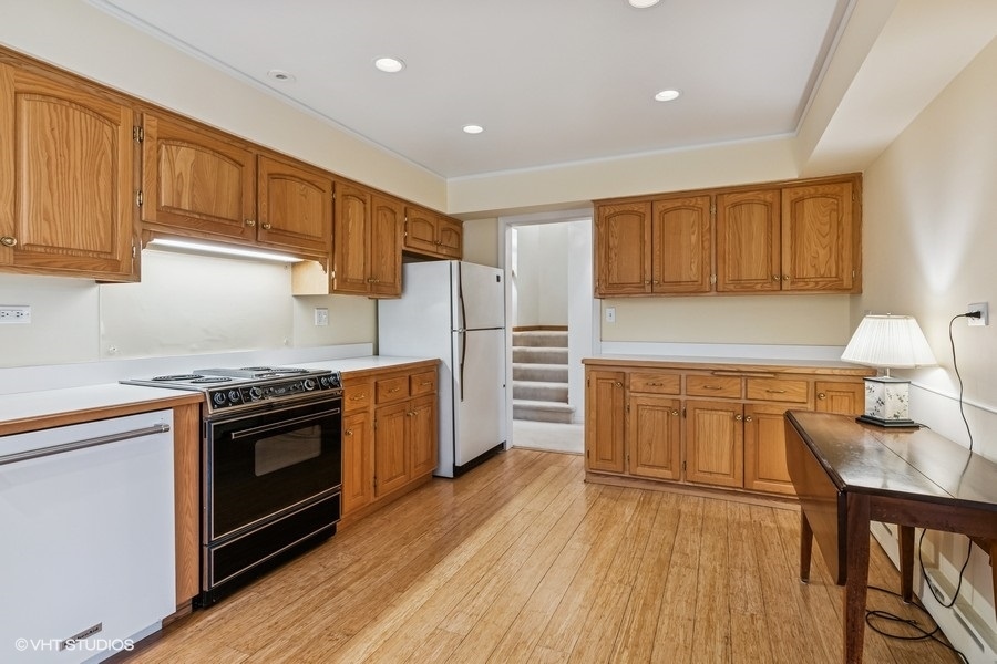 725 Milton Road Inverness, IL 60067 - Photo 10 of 24 a kitchen with stainless steel appliances granite countertop a stove and a sink
