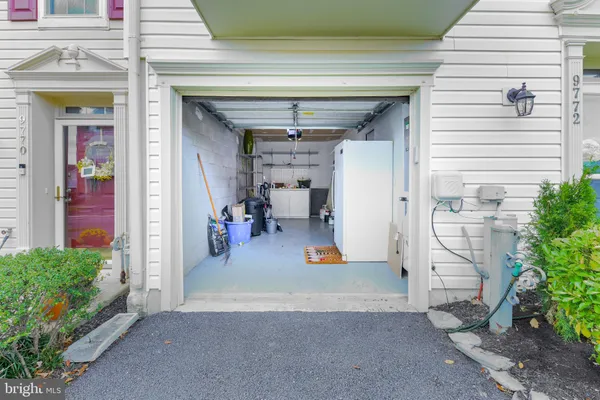 a view of a hallway with seating space