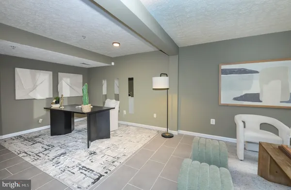 a view of a kitchen counter space and dining room
