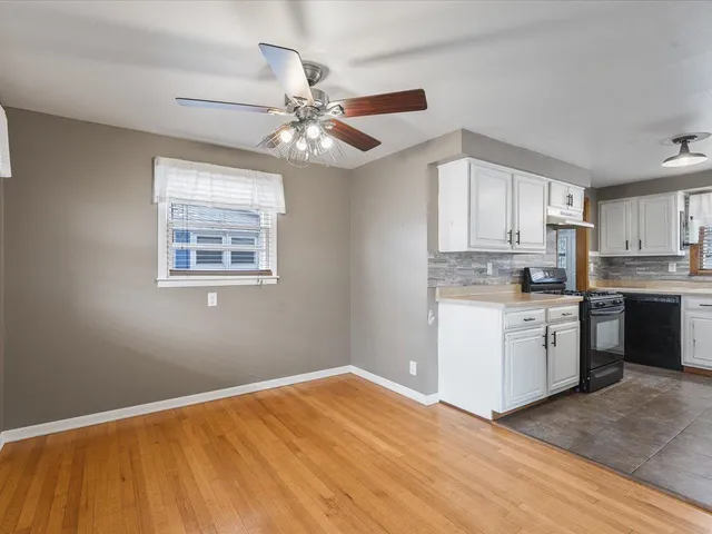 a kitchen with a refrigerator cabinets and a sink