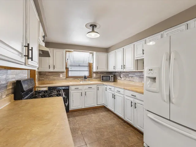 a large kitchen with cabinets