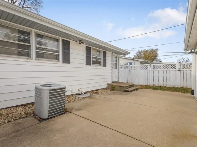 a view of outdoor space and wooden wall