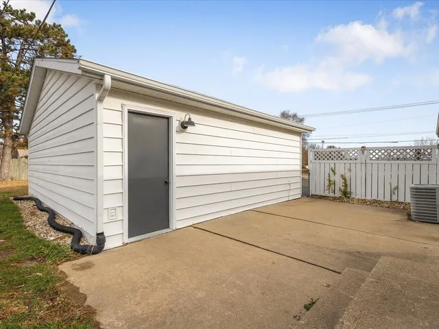 a view of a backyard with garage