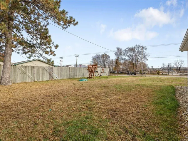 a backyard of a house with lots of green space