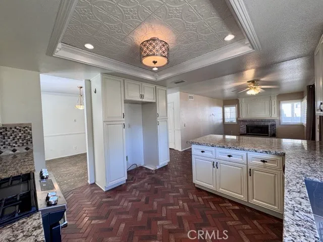 a large kitchen with a stove and a refrigerator