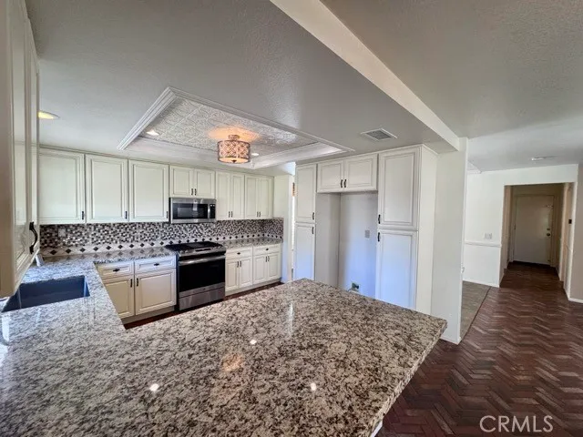 a view of a livingroom with a ceiling fan and window