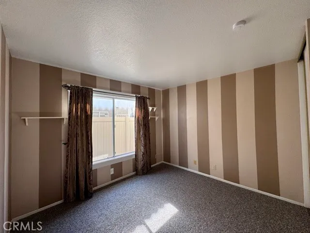 a view of entryway with wooden floor and stairs