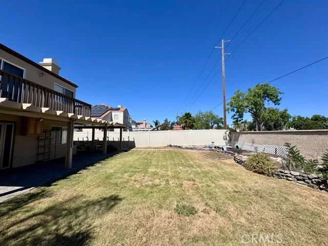 a view of a house with yard and sitting area