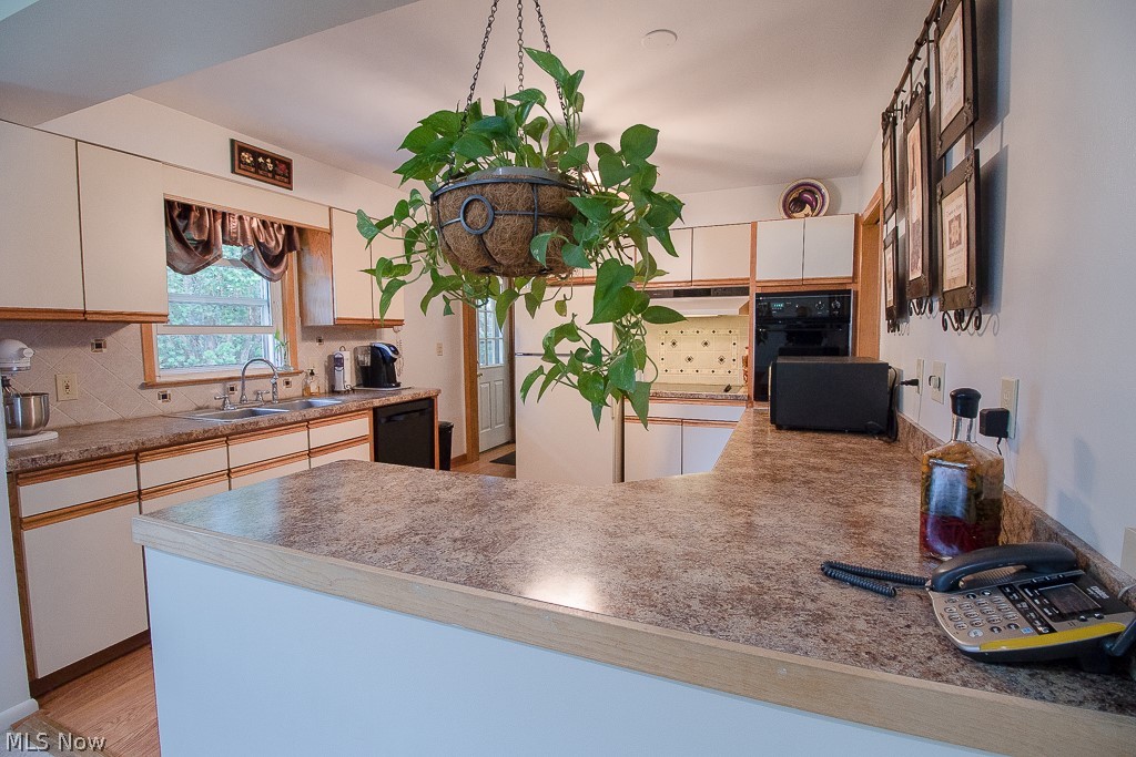 30425 Vineyard Road Willowick, OH 44095 - Photo 2 of 22 Plenty of counter space and room to cook in this kitchen. Check out the cooktop, wall oven, and dishwasher. Ready for all of your entertaining!