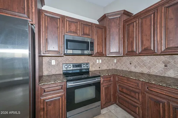 a large kitchen with a large window and a sink