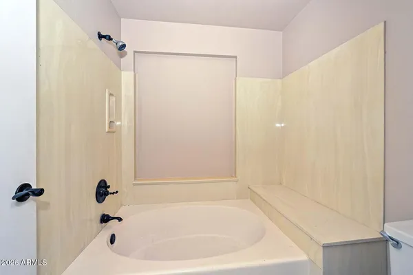 a bathroom with a granite countertop sink a mirror and vanity