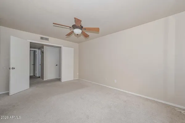 a view of livingroom with a ceiling fan and window