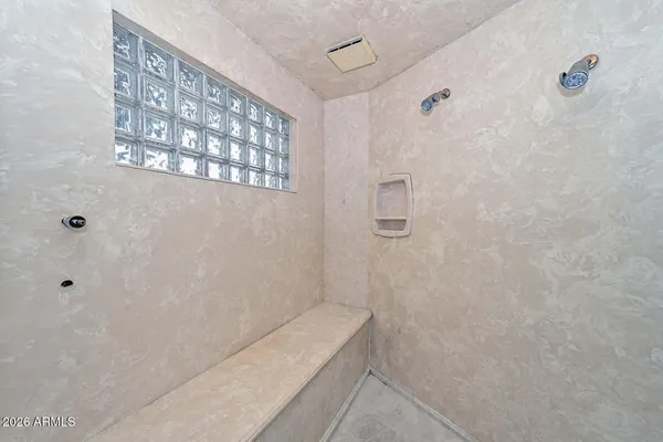 a large bathroom with a large tub shower and sink