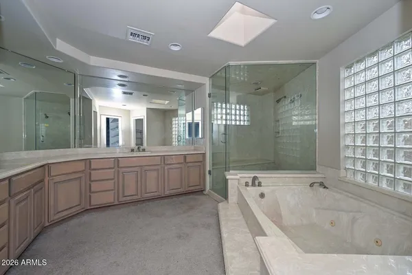 a bathroom with a bathtub and shower