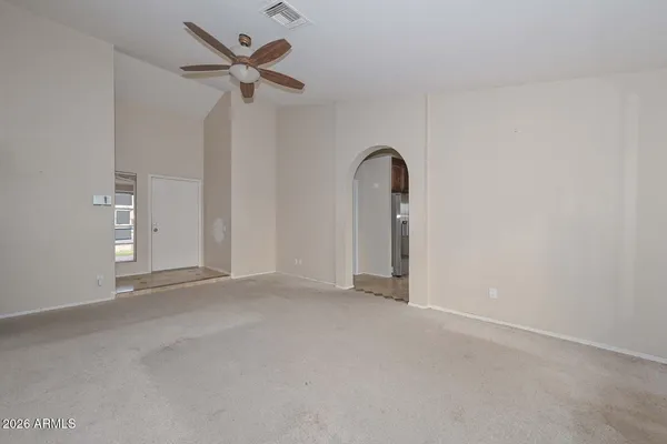 a view of an empty room with a window