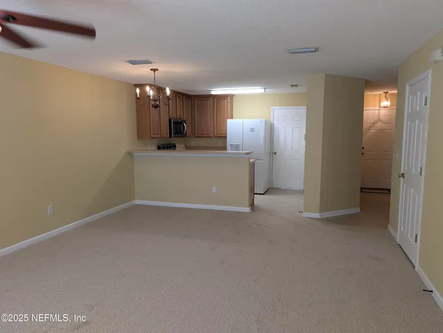 a view of a kitchen with a sink